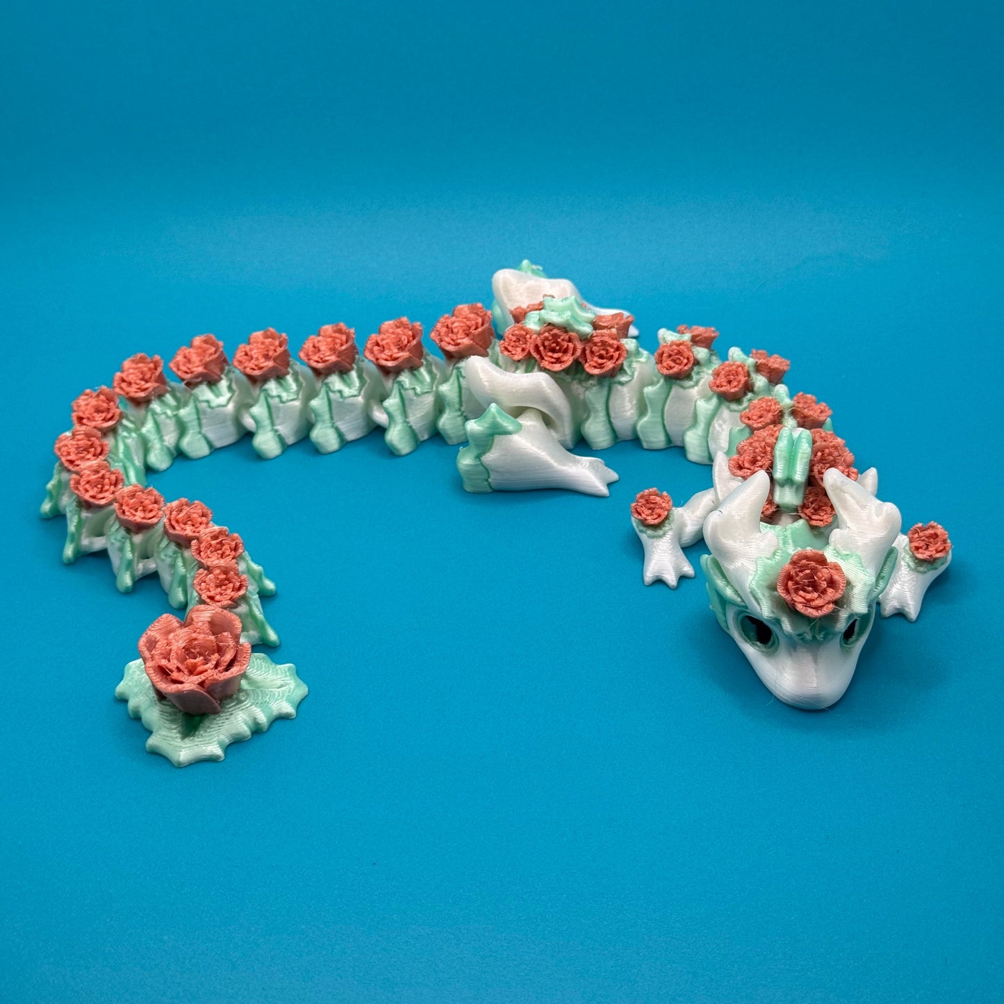 Dragon figurine on a blue background