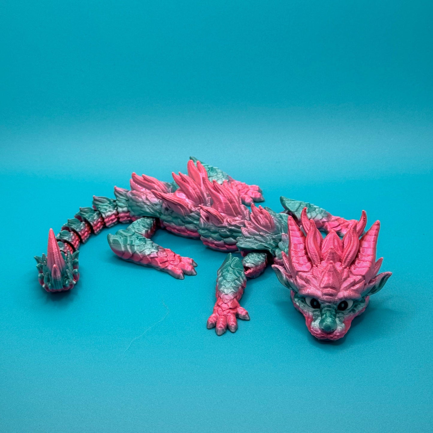 Dragon figurine on a blue background
