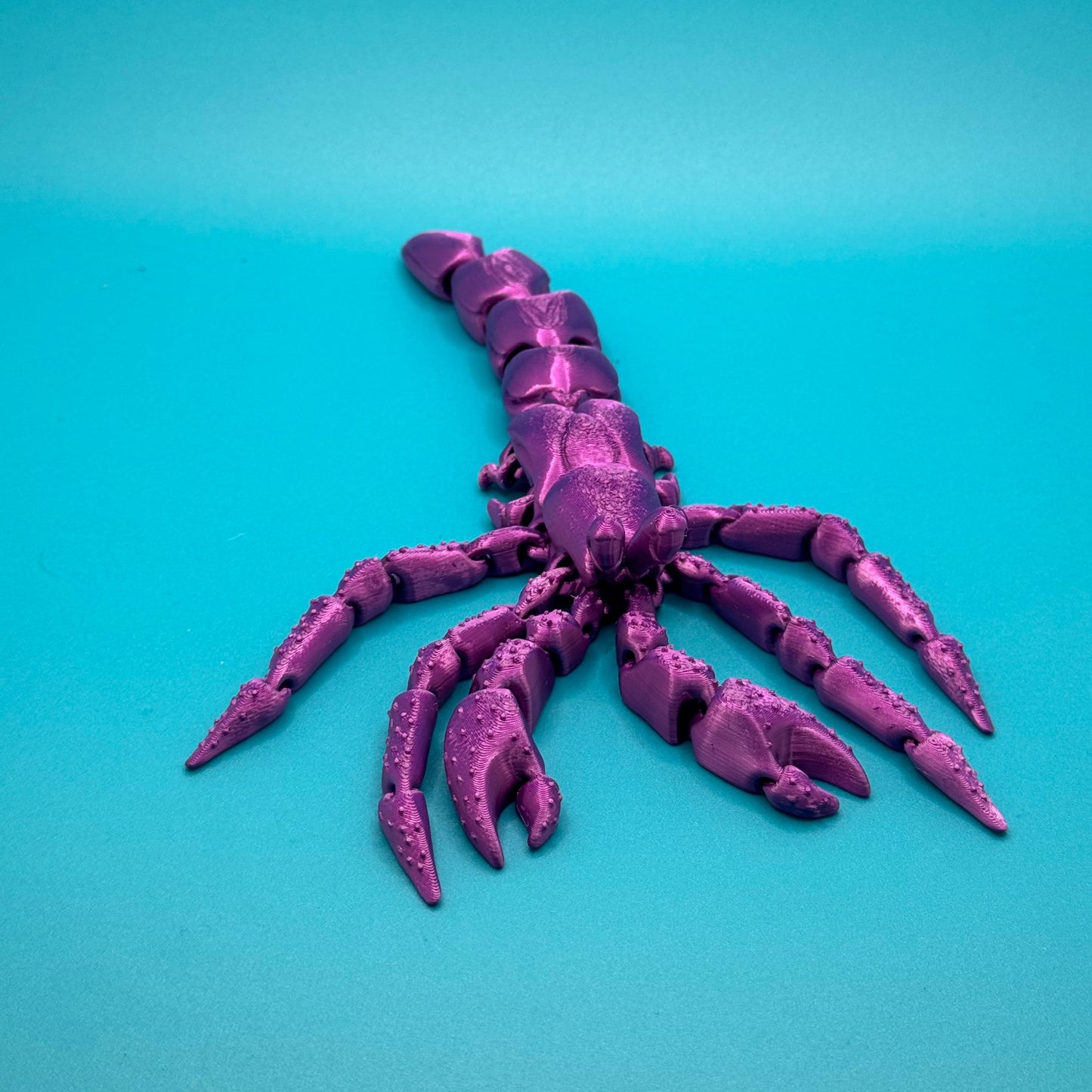 3D Printed Hermit Crab on Blue Background