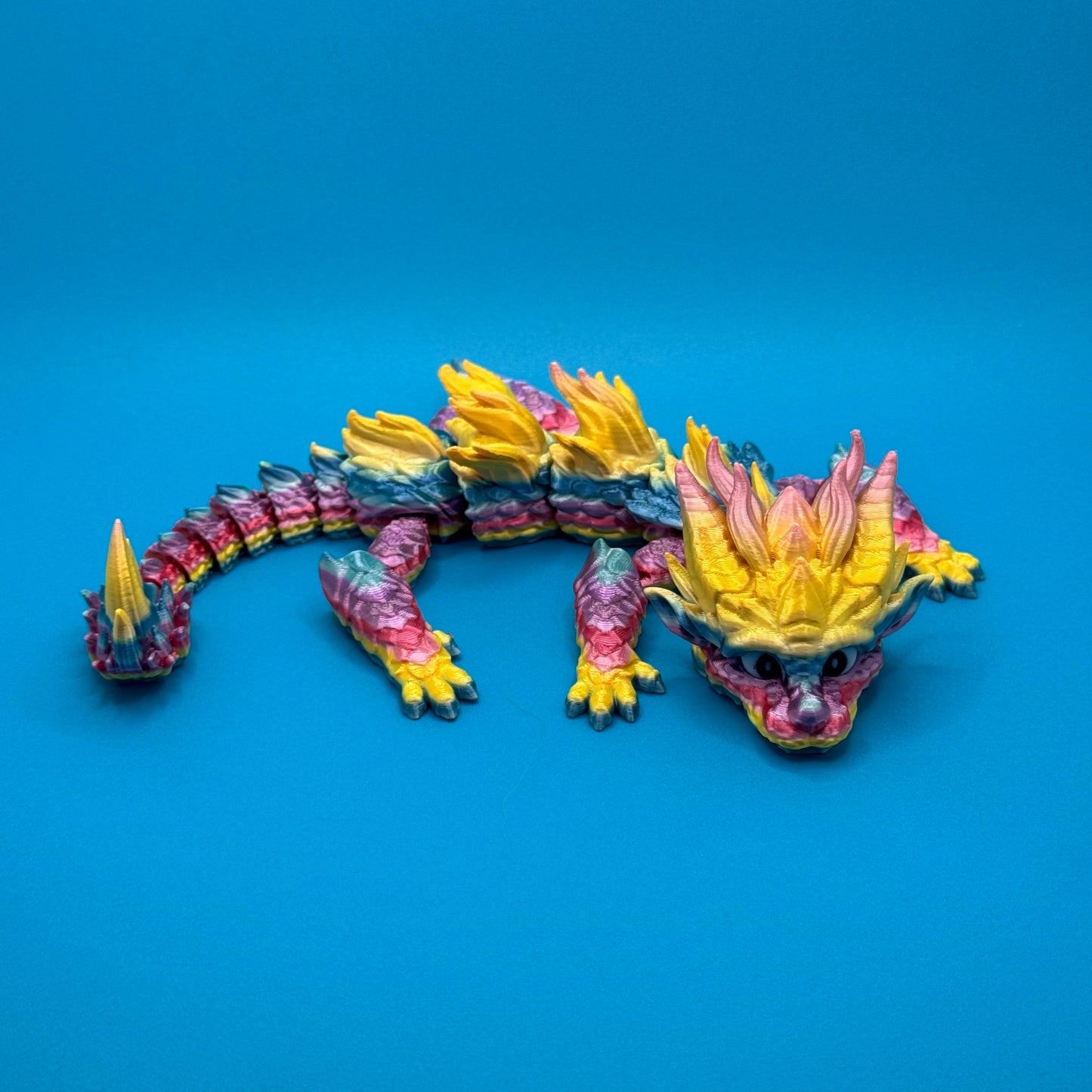 Dragon figurine on a blue background