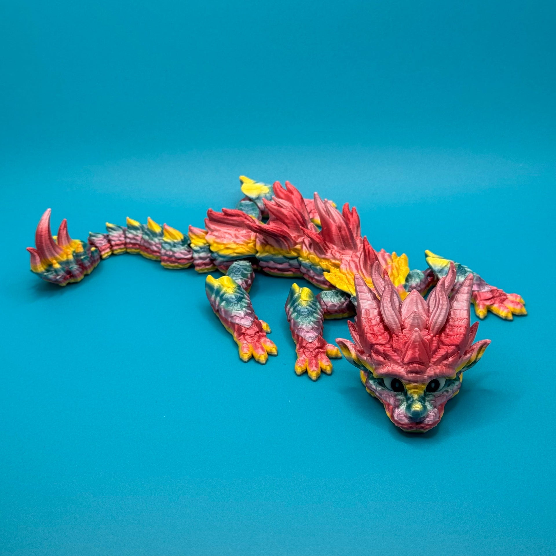 Dragon figurine on a blue background
