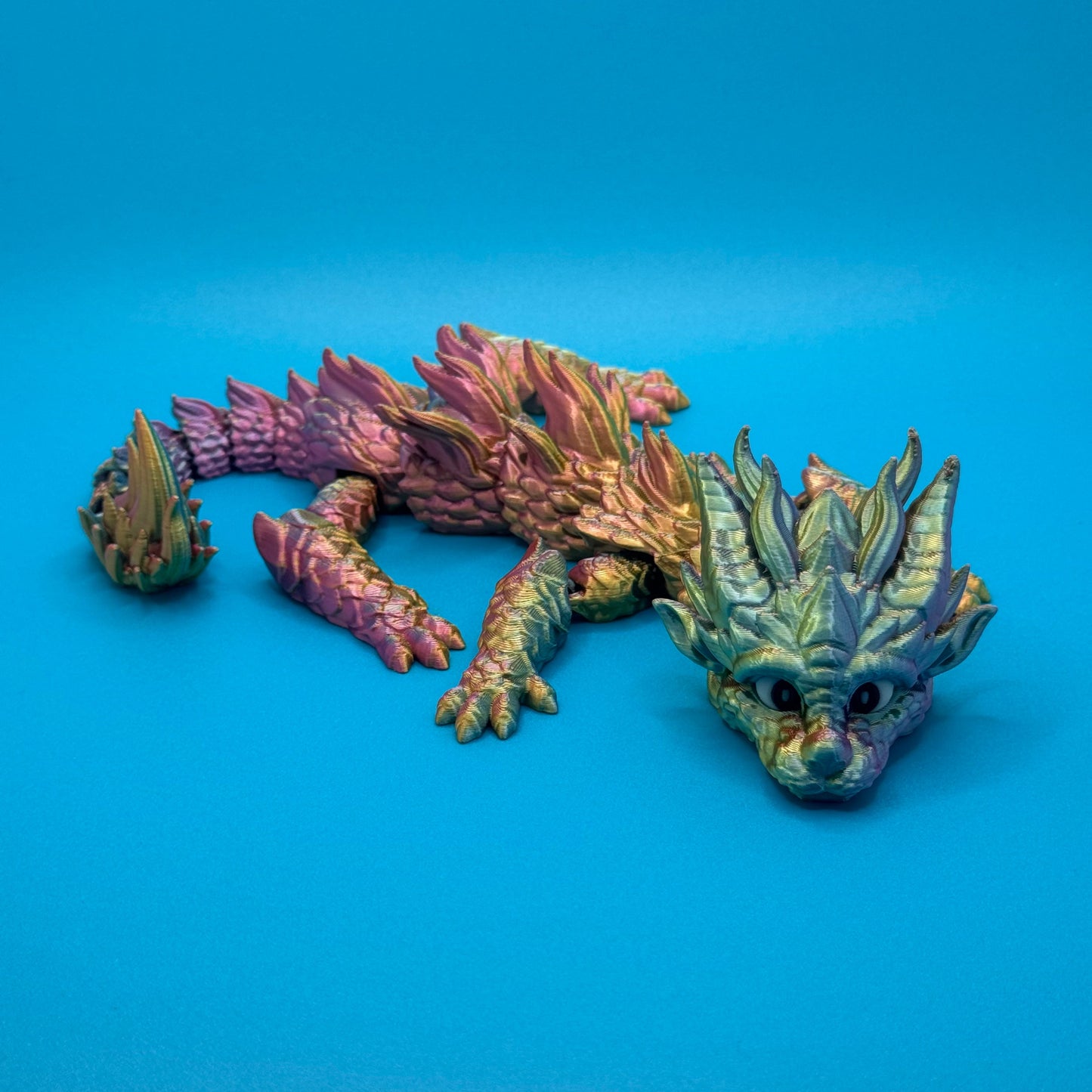 Dragon figurine on a blue background