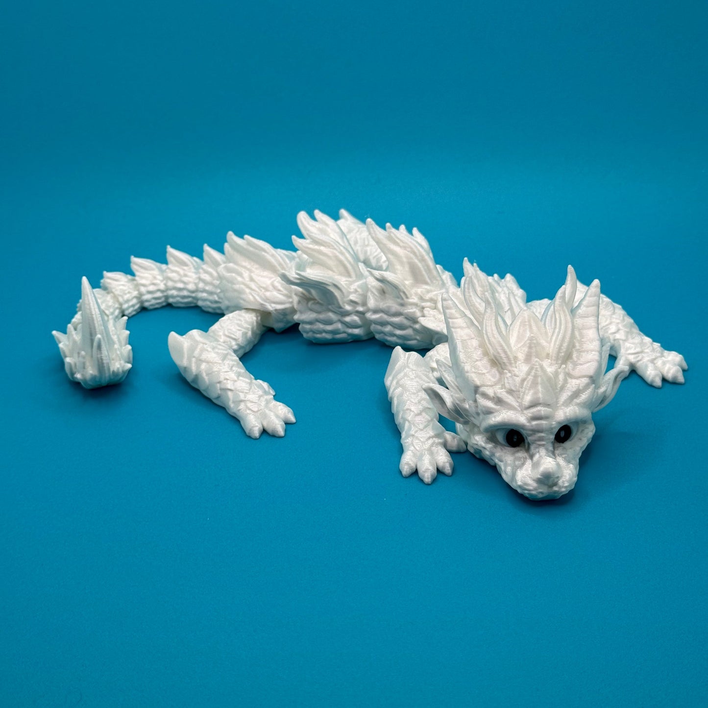 Dragon figurine on a blue background